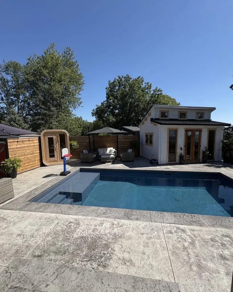 Finished inground pool with stamped concrete deck