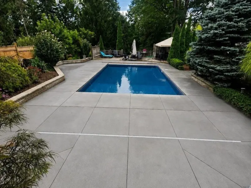 Finished vinyl pool with new concrete deck